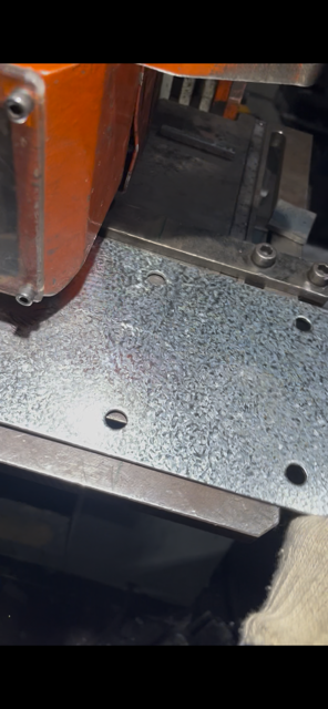 Close-up of fixing holes in the galvanised bracket