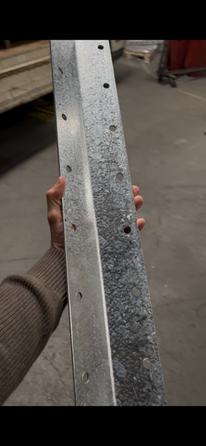 Finished galvanised bracket shown inside in the manufacturing workshop