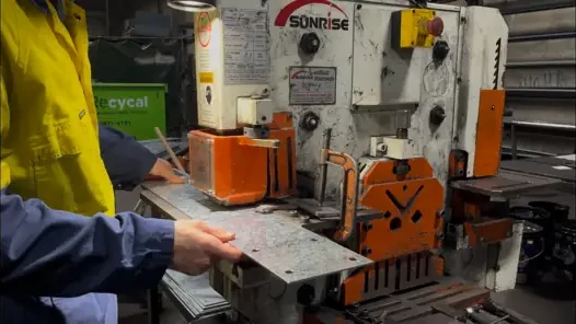 Punching the fixing holes into a bracket